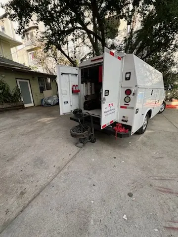 Magnet Plumbing service vehicle on-site for Grease Trap Cleaning in Great Neck Estates
